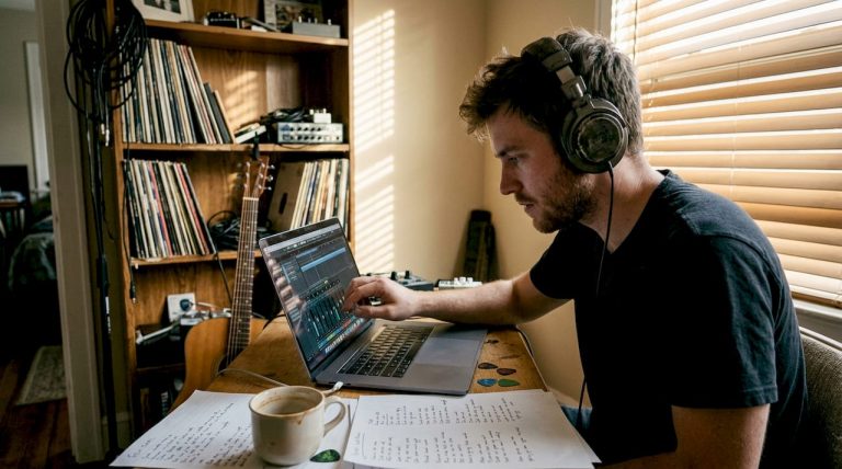 Independent musician working in home studio