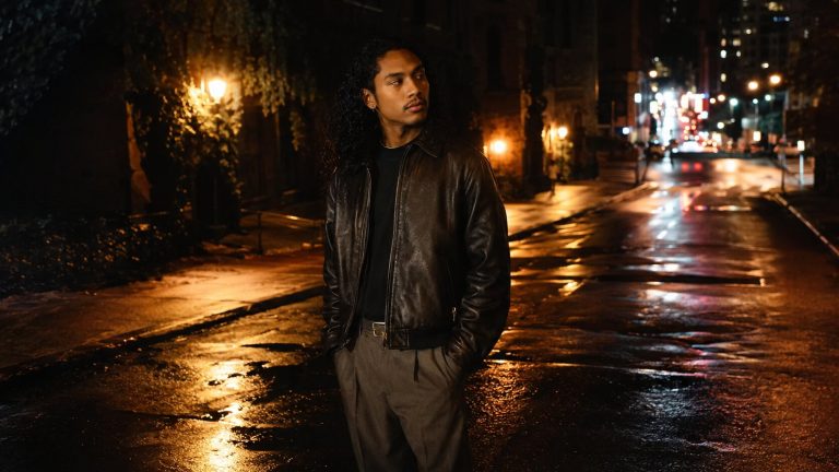 Solitary Stroll Through Rainy City Lights